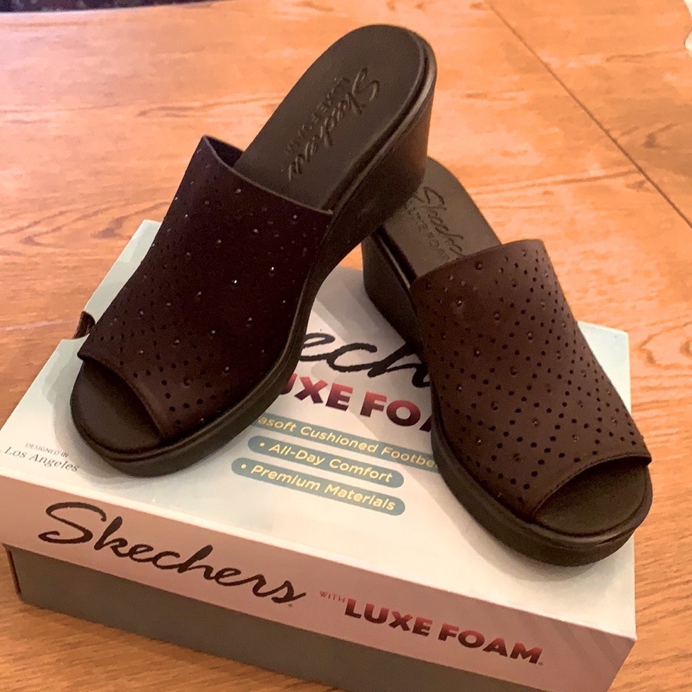 Skechers slip on studded women’s shoes.